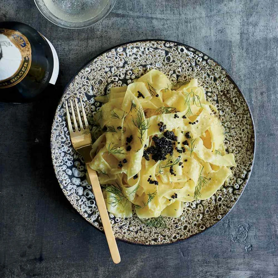 Ribbon pasta topped with caviar and fresh dill